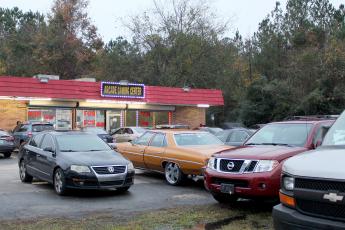 Vehicles fill the parking lot at Arcade Gaming Center in Callahan just after 5 p.m. Friday, also parking in the grass near the traffic lanes of U.S. 1. Adult arcades in Nassau County have nearly doubled in number of establishments since they were shut down in Duval County in October. 