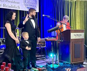 Camden County Commissioner and Readdick Construction CEO Trevor Readdick was recently named president of the Home Builders Association of Georgia. With Readdick is his wife, Nicole Readdick, and son, Frazier.