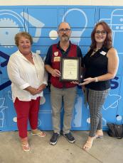 From left are Camden House board member Linda O’Shaughnessy, Lowe’s assistant manager Matt Kopycienski and Camden House Executive Director Marcie Costello.