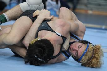 Camden’s Gavin Daniels locks up Randy Smith of Colquitt en route to a first-period pin. (Andy Diffenderfer, Tribune & Georgian)