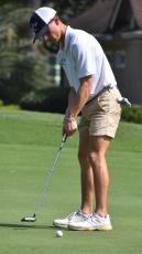 The Wildcats’ A.J. Corsi drills a putt at the 16th hole Saturday. (Andy Diffenderfer, Tribune & Georgian)