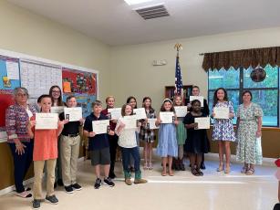 Award recipients of the Earl of Camden Chapter of the Daughters of the America Revolution included, front row, from left, Liam Ross (Crooked River Elementary School), Grant Garman (St. Marys Middle School), Logan MacRae (Woodbine Elementary School), Patsy Wells (Matilda Harris Elementary School), Laney Grace Blount (Mary Lee Clark Elementary School) and Kaylah Anderson (Kingsland Elementary School). Back row: Nanette Moreira, Addison Mulhair (Camden Middle School), Liliana Spencer (St. Marys Elementary Scho