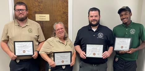 Camden County Board of Commissioners, from left, Animal Control’s Tyler Schlemmer, Tracy Webb, Jerod Wells and Trevyon Simmons recently received certifications from the National Animal Care & Control Association.