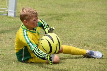 Blake Ludwig stretches for a save at the Challenger soccer camp. (Andy Diffenderfer, Tribune & Georgian)