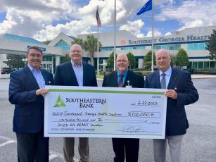 Southeastern Bank recently donated $100,000 to Southeast Georgia Health System’s Camden Campus through the Georgia HEART Hospital Program. From left are Southeastern Bank Senior Vice President Jim Lomis and President and CEO Jay Torbert, Camden Campus Vice President and Administrator Glenn Gan and Southeast Georgia Health System President and CEO Scott Raynes.