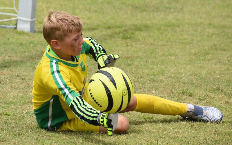 Blake Ludwig stretches for a save at the Challenger soccer camp. (Andy Diffenderfer, Tribune & Georgian)