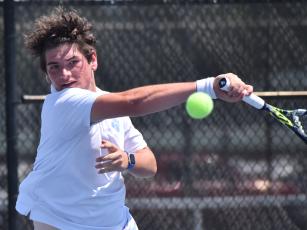 Sam Rossi mashes a forehand in the No. 1 singles match against Lambert. (Andy Diffenderfer, Tribune & Georgian)